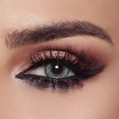 Close-up of an eye with bronze shadow wearing Bella Glow Luminous Pearl colour contact lens